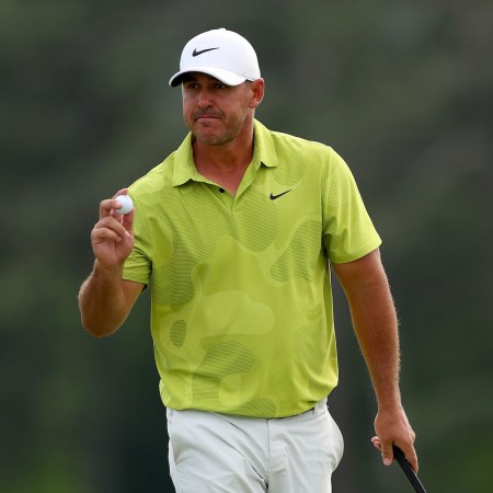 Brooks Koepka reacts to his birdie on the 18th green during the first round of the 2023 Masters Tournament