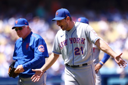 Max Scherzer #21 of the New York Mets reacts after an ejection by umpire Phil Cuzzi #10 during the third inning against the Los Angeles Dodgers at Dodger Stadium on April 19, 2023 in Los Angeles, California.