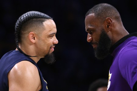 LeBron James #6 of the Los Angeles Lakers talks with Dillon Brooks #24 of the Memphis Grizzlies before Game Three of the Western Conference First Round Playoffs at Crypto.com Arena on April 22, 2023 in Los Angeles, California.