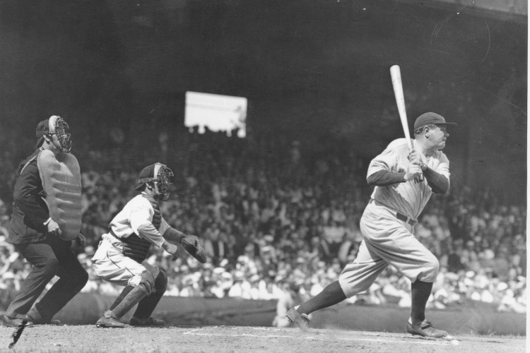 CLEVELAND, OH - MAY 20, 1934: Babe Ruth lines a single to right field at League Park. The Yankees lost to the Indians 8-5. Ruth singled twice and struck out twice in a losing effort.