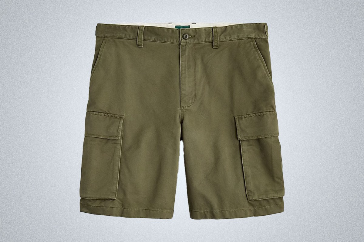 a pair of army green J.Crew 10" Cargo Shorts on a grey background