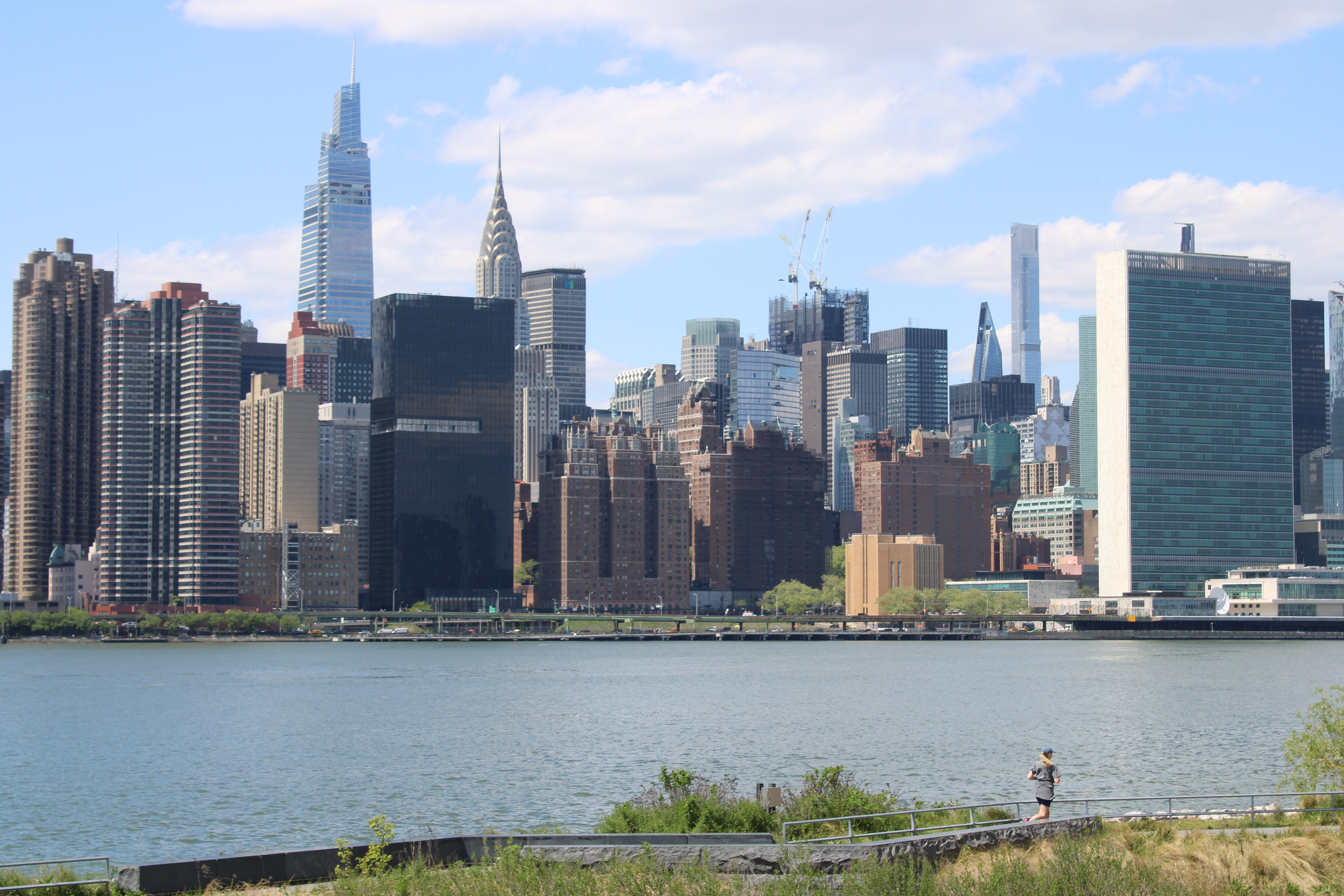 A runner running along the Long Island City waterfront.