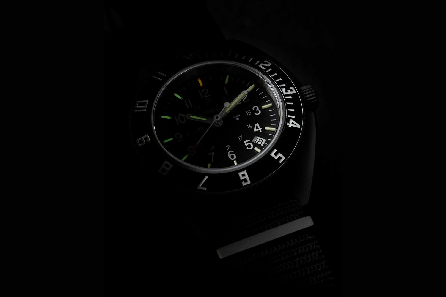 A darkened image with parts of a watch 