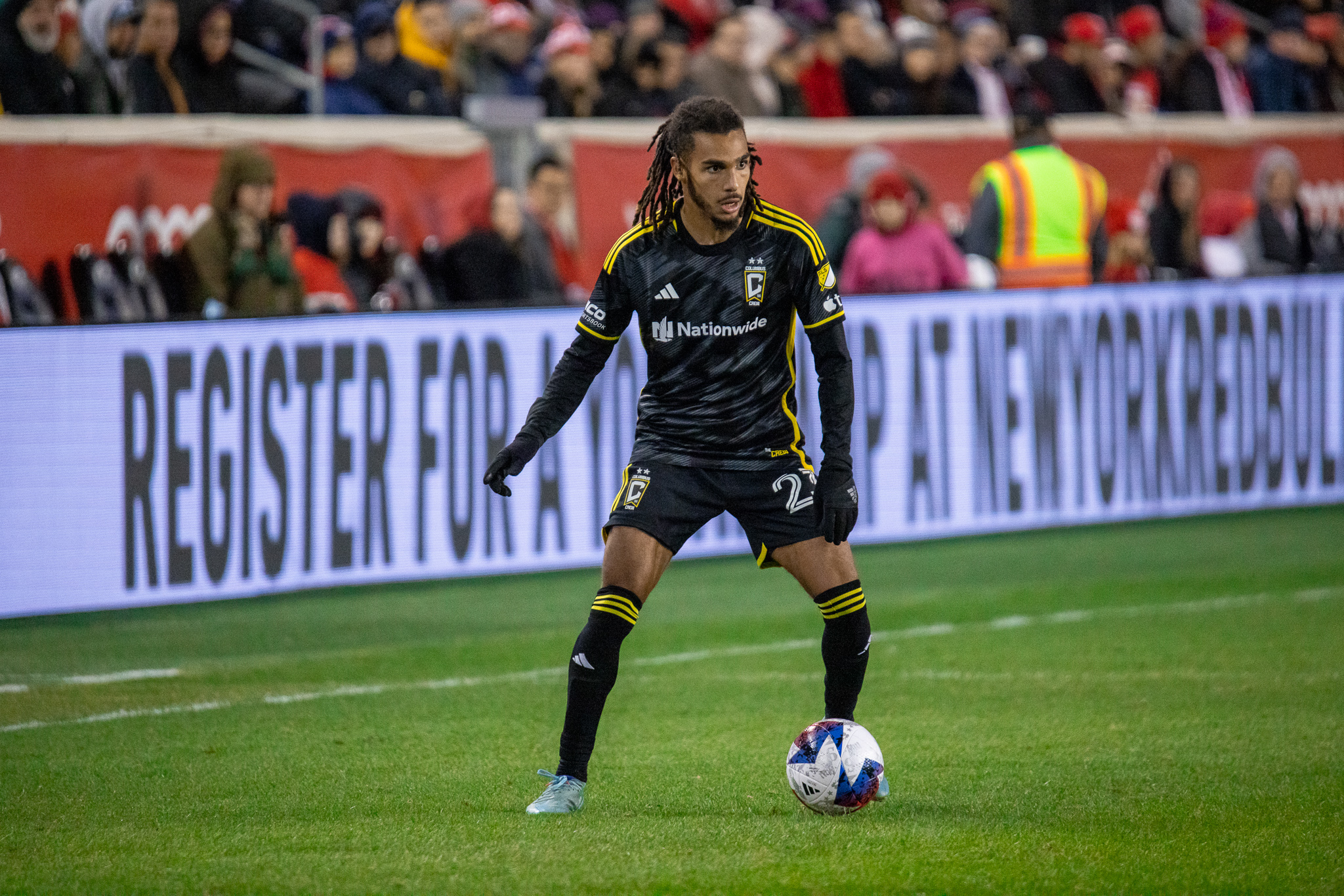 Mohamed Farsi of the Columbus Crew looks for a teammate to pass to on the pitch