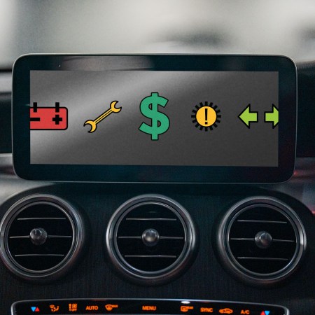 A screen on a car dashboard showing warning icons and a dollar sign. We discuss the problem with modern advanced car-safety systems.