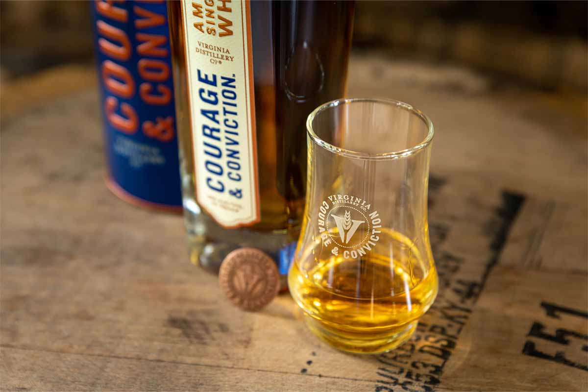 Two bottles and a dram of Courage and Conviction, the flagship release of Virginia Distillery Co.