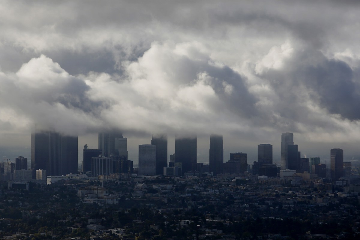 Storm clouds gather over the skyline of downtown Los Angeles, California, U.S.