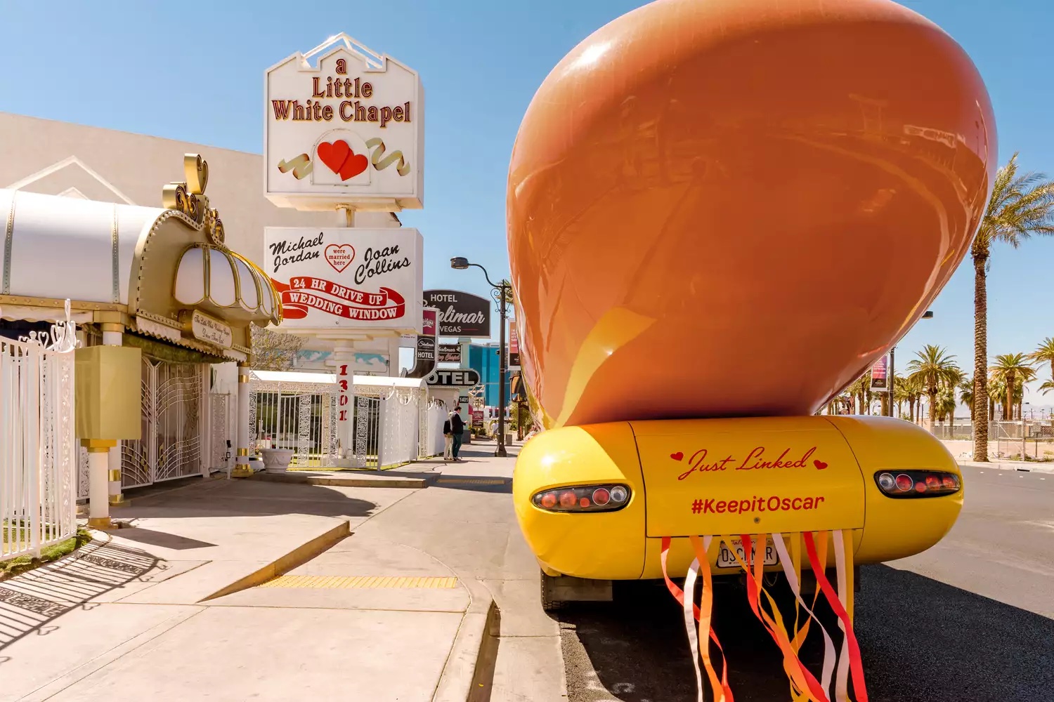 oscar mayer wienermobile parked outside the little white wedding chapel in las vegas