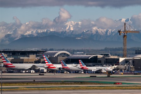 Hollywood sign as seen from LAX with snow covered mountains in background © Pete Halvorsen
