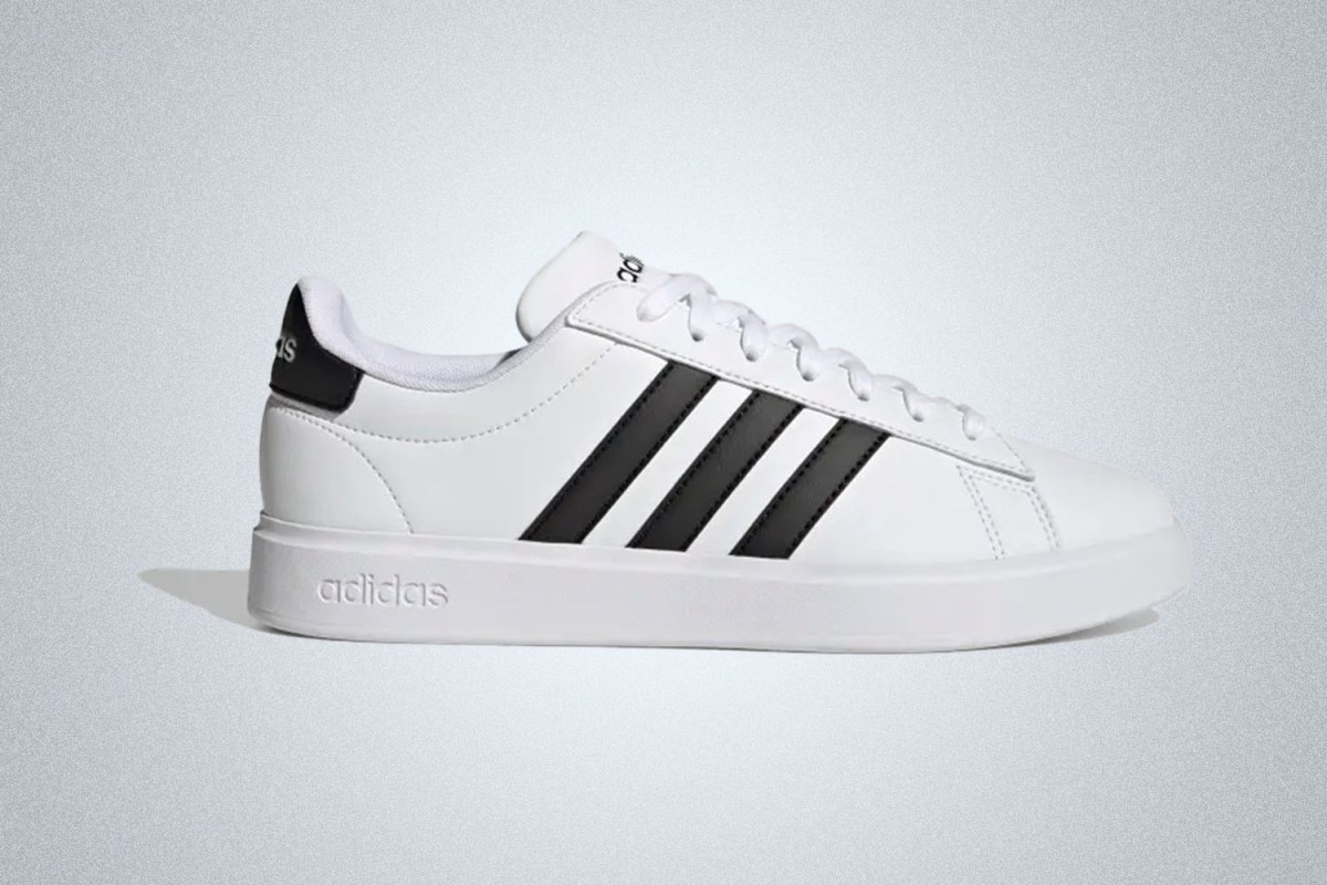 a pair of white Adidas Grand Court 2.0 Sneakers on a grey background