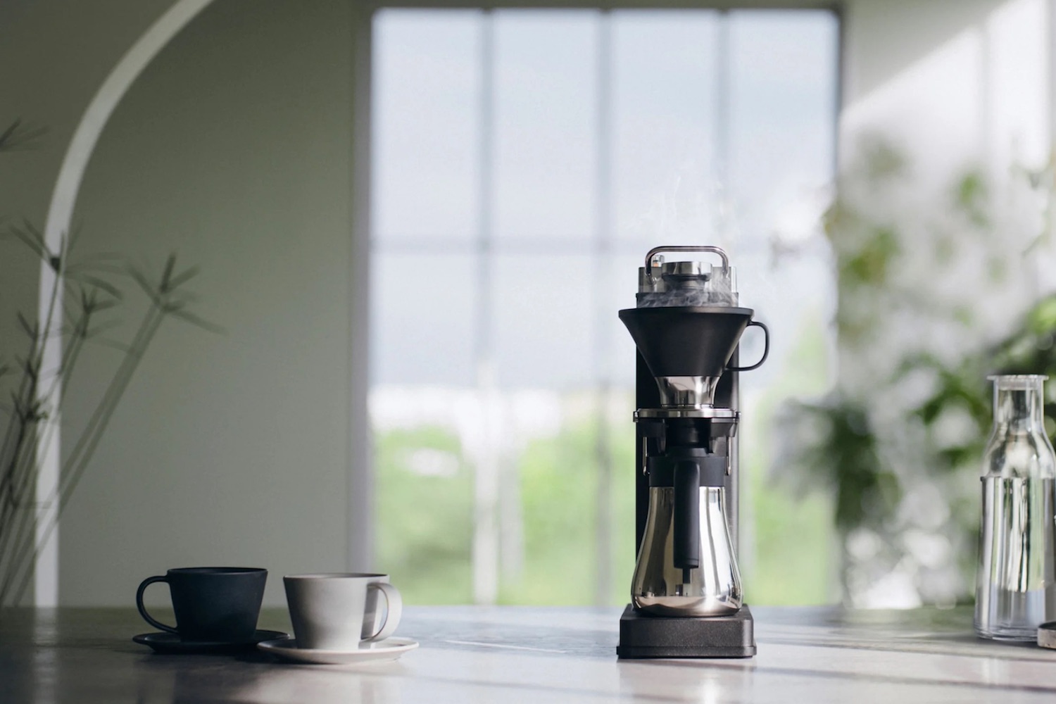 a Balmuda The Brew coffee maker on a marble counter