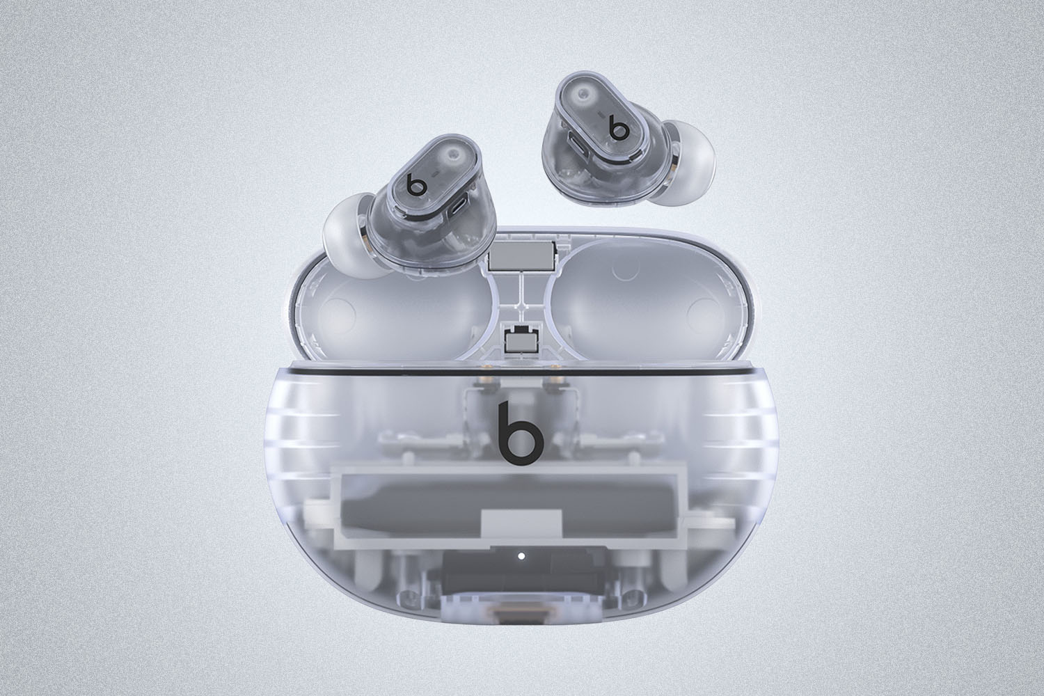 a pair of Beats Studio Buds + on a grey background