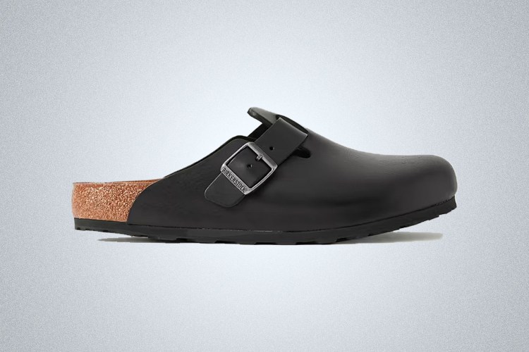 a pair of dark Birkenstock Boston sandals on a grey background