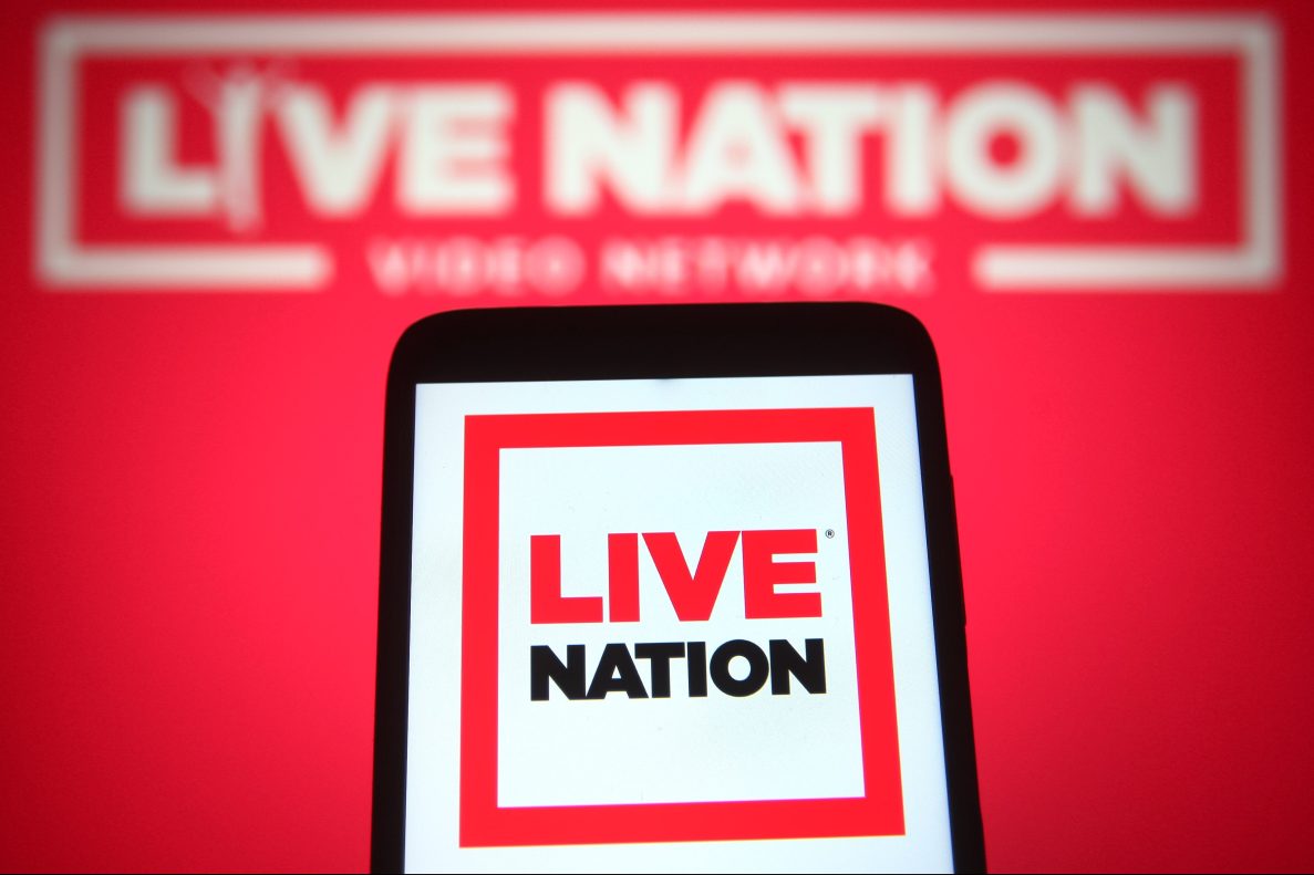 A Live Nation Entertainment logo is seen on a smartphone and a pc screen