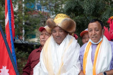 Nepali mountaineer Kami Rita Sherpa (C), who broke his own world record for the most summits after climbing Mount Everest for the 26th time, is welcomed after arriving at Tribhuvan airport in Kathmandu on May 27, 2022