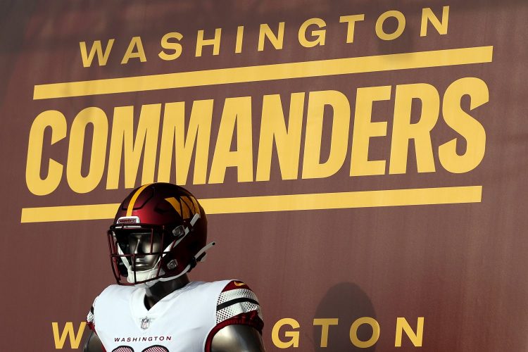 washington commanders football team logo behind mannequin in NFL football uniform