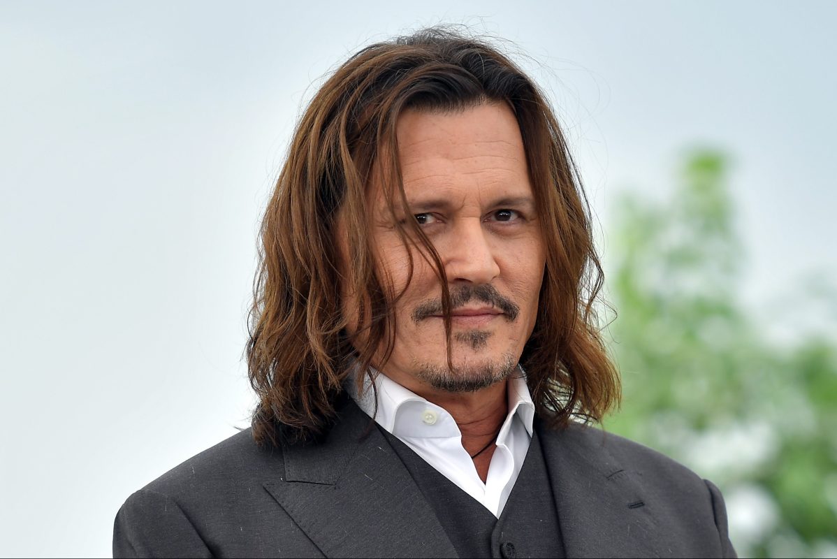 Johnny Depp attends the "Jeanne du Barry" photocall at the 76th annual Cannes film festival at Palais des Festivals on May 17, 2023 in Cannes, France.