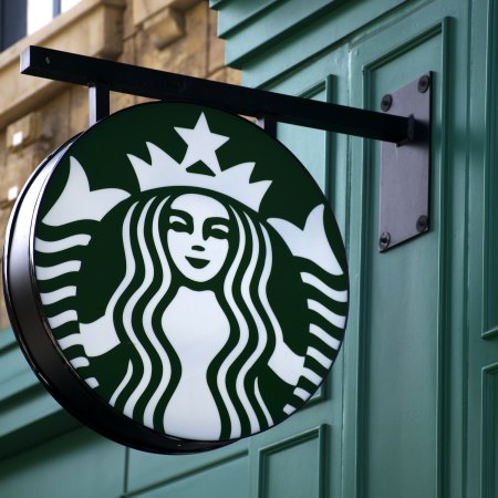 Starbucks sign outside of a store.