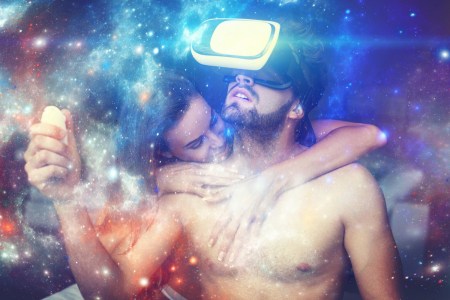 Naked couple playing virtual reality at home, man with VR glasses opening magical universe of fantasy