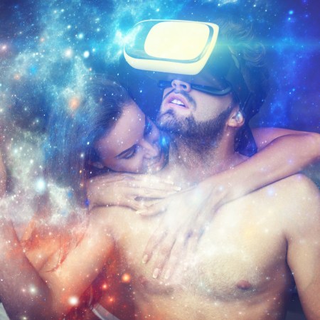 Naked couple playing virtual reality at home, man with VR glasses opening magical universe of fantasy