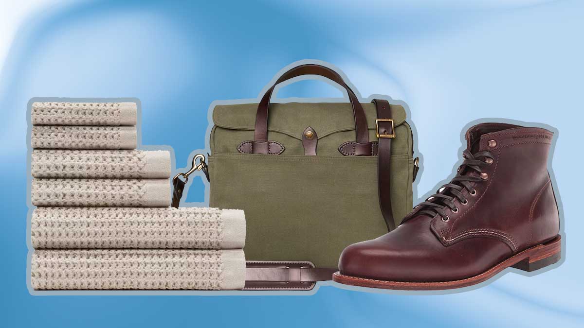 Onsen towel bundle, Filson briefcase and Wolverine 1000 mile boots, some of the best graduation gifts of 2023, on a blue background