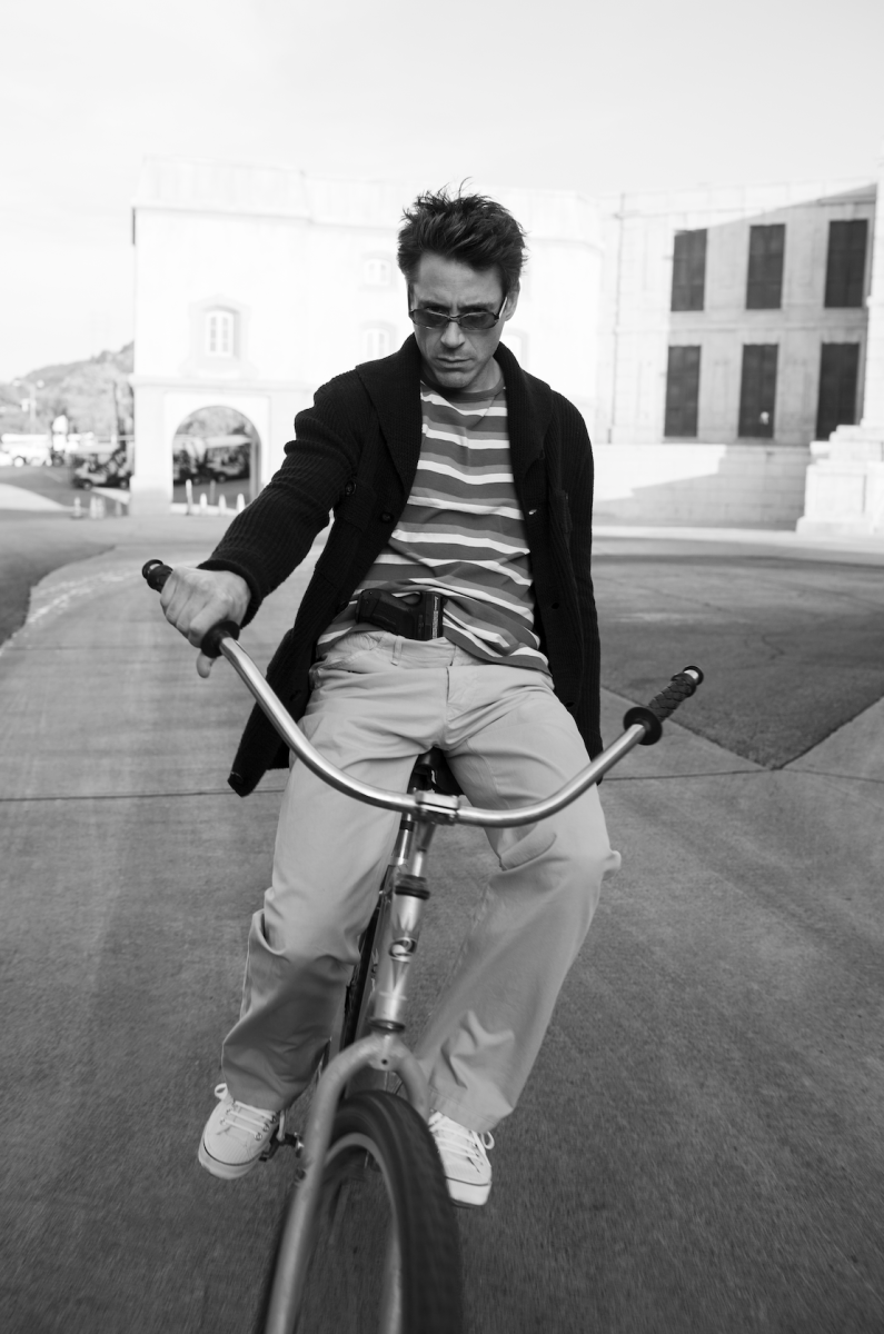 "I took this photo of Robert Downey Jr. on the back lot at Universal Studios, where there are all these different areas. I think it was between Ancient Rome and Western Street. Robert’s on a bike and he’s riding all over the place. He’s a real proper old-school entertainer. A hugely, hugely talented man with extraordinary energy — if you’ve never seen <em>Chaplin</em>, then it’s worth watching to see the sort of technical, physical performer he is. We were having lots of fun with him playing different characters. And we had this gun, because we’d done some shots of him bursting out of sets, doing rolls, doing dives, jumping around."<br>