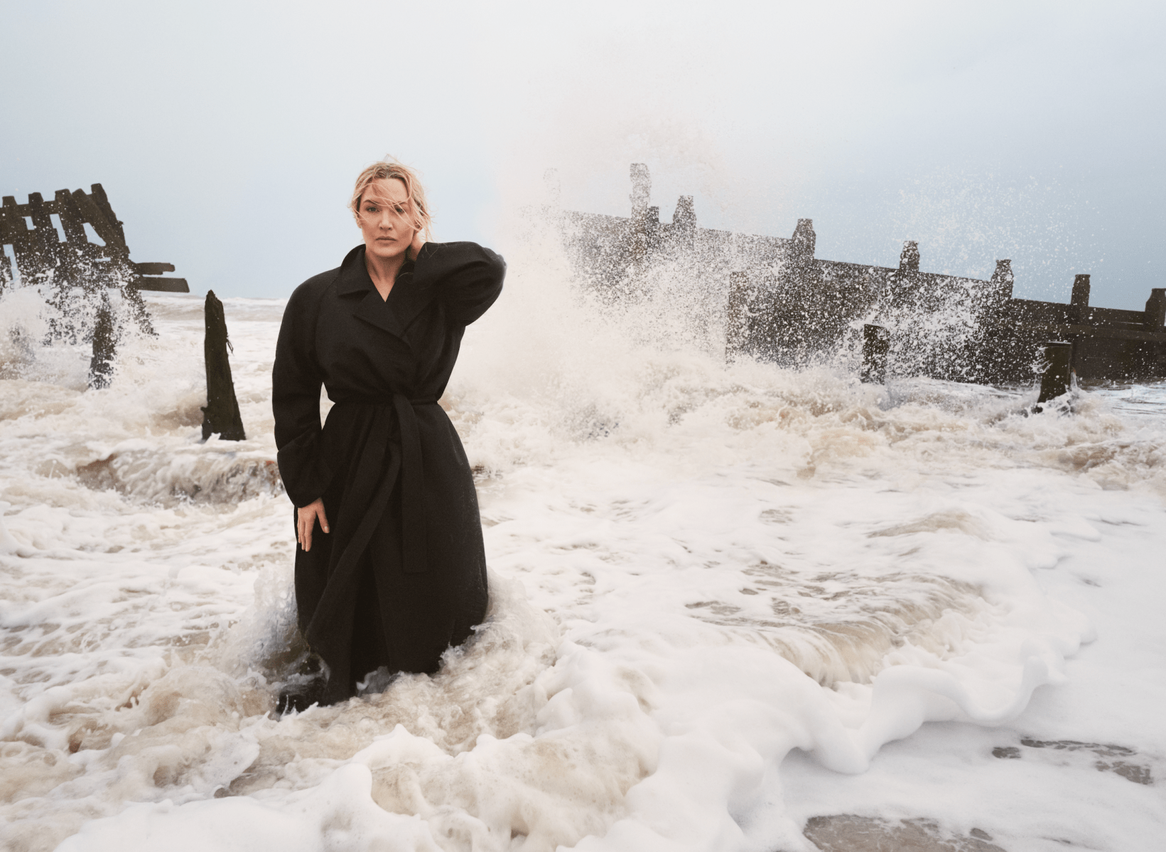 "This is Kate Winslet standing in the ocean, and it’s definitely one of my favorite pictures from the last couple of years. We’re not a long way from where she lives, and we went for a walk down the beach. It was very much her idea. I wanted to get her in the sea, but I’d imagined a long sandy beach, nothing like this violent and powerful scene. We both loved the fact that back in the day, this would have taken hundreds of assistants, fashion assistants, special effects crews, people would have brought extra wave machines to make sure it was wavy enough. But here we just did it. Her husband was helping me — I even had to borrow his wellies. Compositionally, she’s framed perfectly by the breakwaters, one-third across the frame."<br>