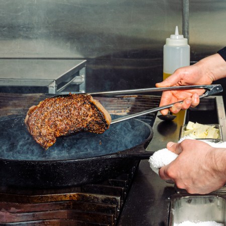 steak over a cast-iron skillet.