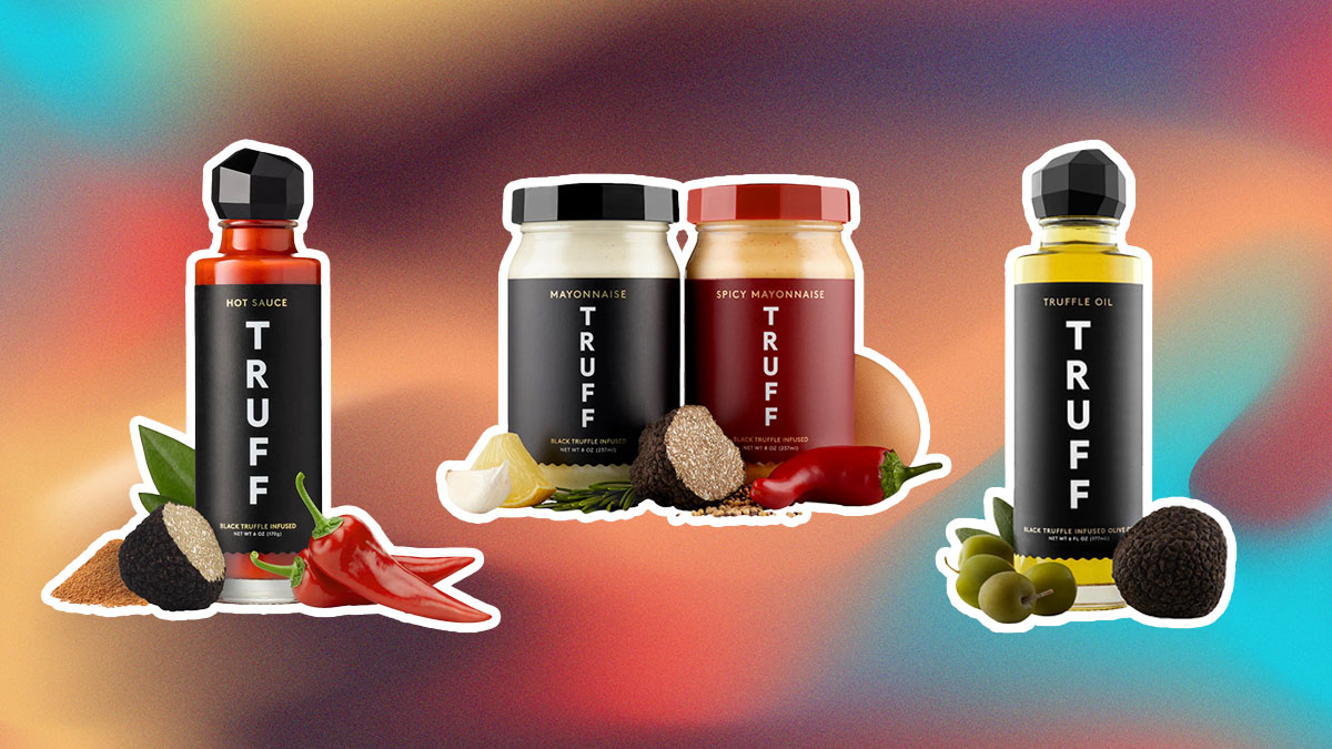 Truff bottles of hot sauce, truff oil and truff mayo products on an abstract pink and blue and red background