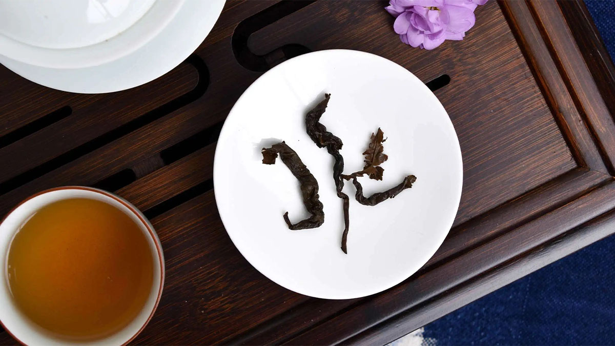 Verdant Tea leaves laying on a white porcelain plate