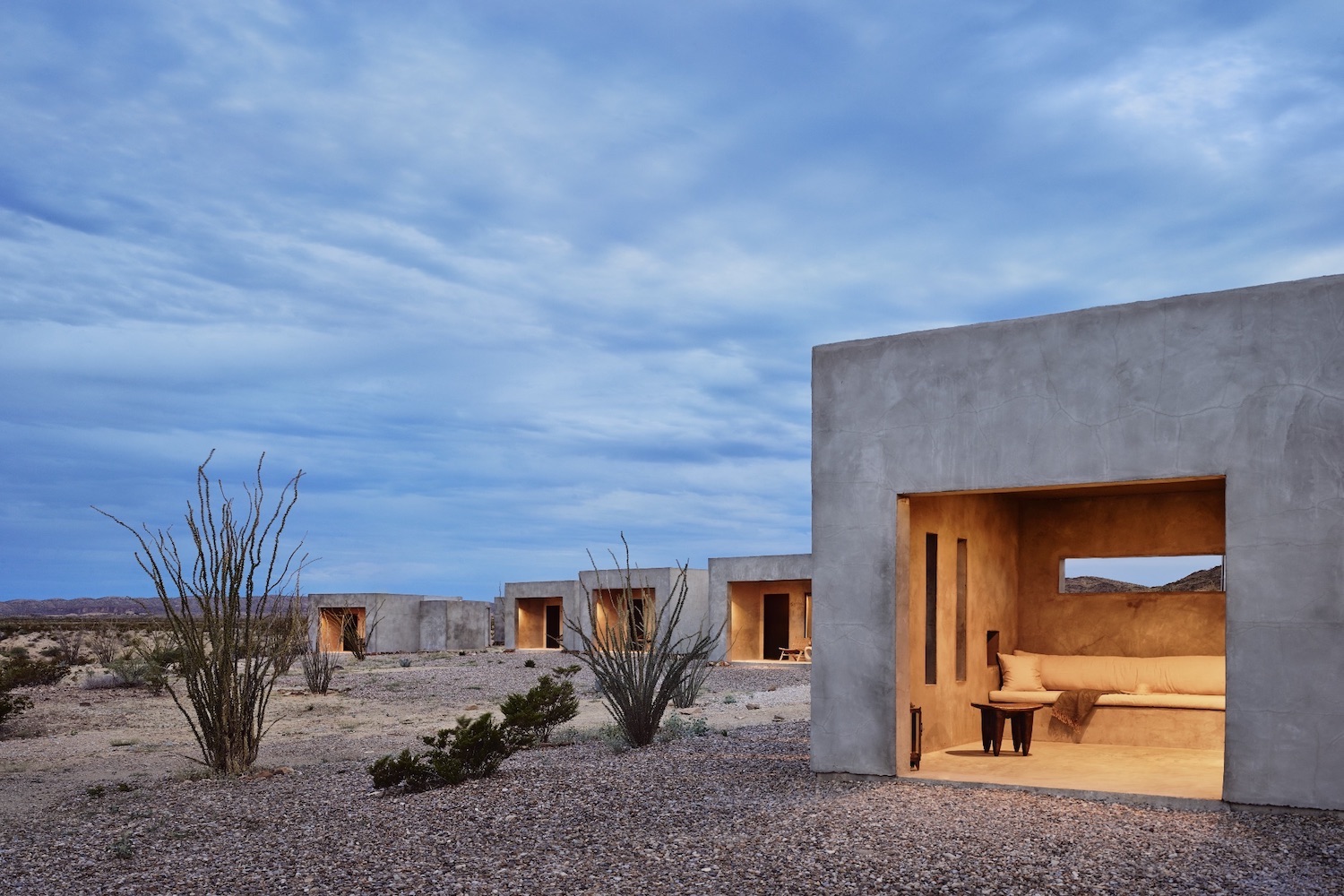 white square-shaped house in desert