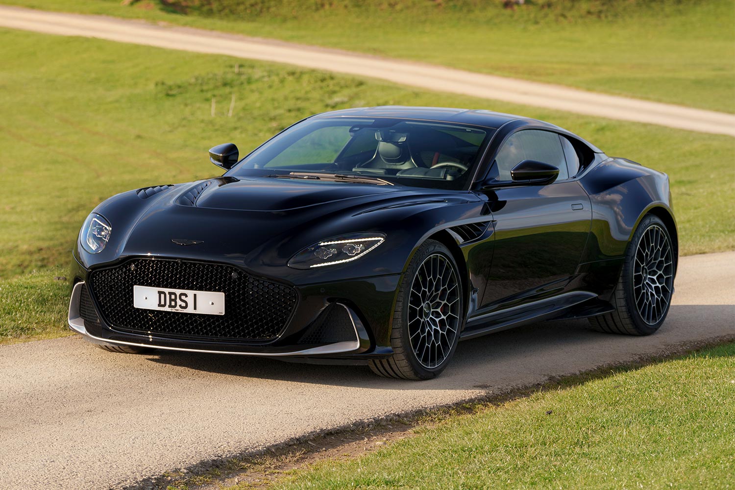 The final Aston Martin DBS 770 Ultimate sitting on a country road in the U.K.