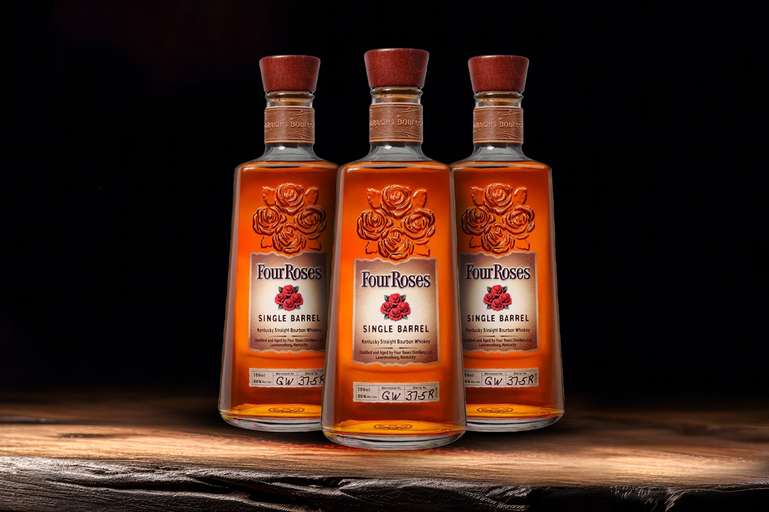 3 bottles of four roses on a wooden table