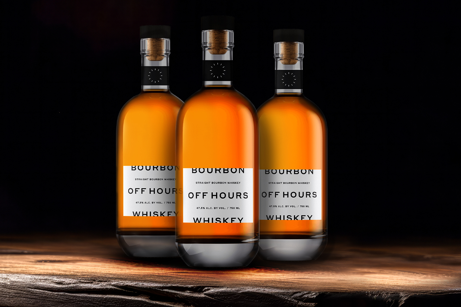 3 bottles of off hours bourbon on a wooden table