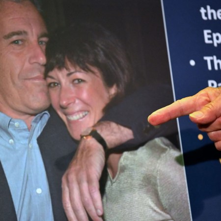 Finger pointing at a photo of Jeffrey Epstein