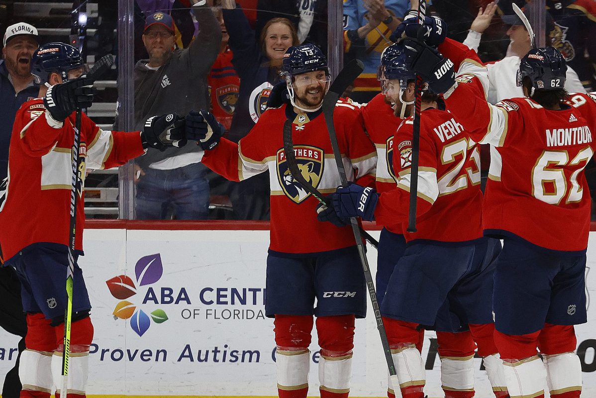 Sam Reinhart and the Florida Panthers celebrate his goal.