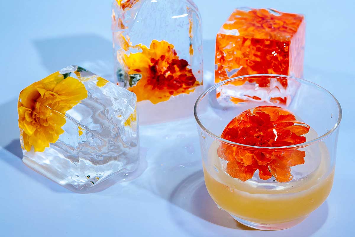 Passion Project on an Edible Flower Ice Sphere cocktail from "The Ice Book"