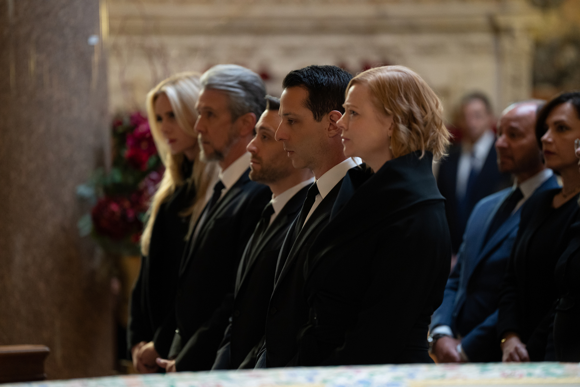 Justine Lupe, Alan Ruck, Kieran Culkin, Jeremy Strong, Sarah Snook stand in character at the funeral for Logan Roy in season four of "Succession"