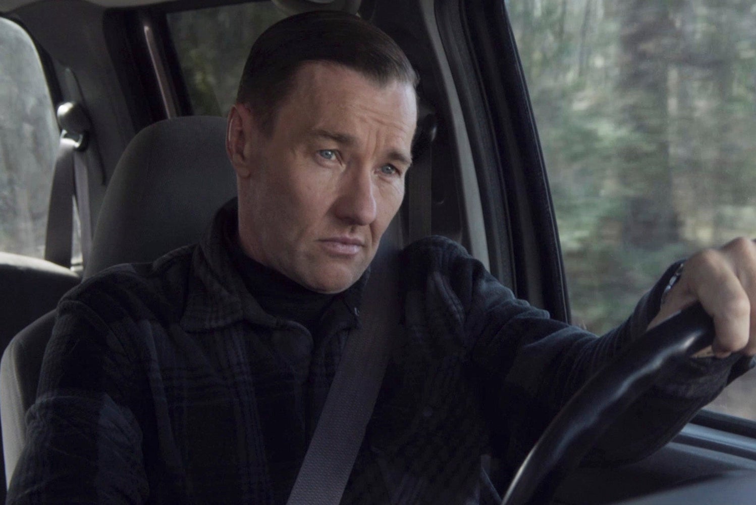 actor Joel Edgerton driving a car as narvel roth in movie master gardener