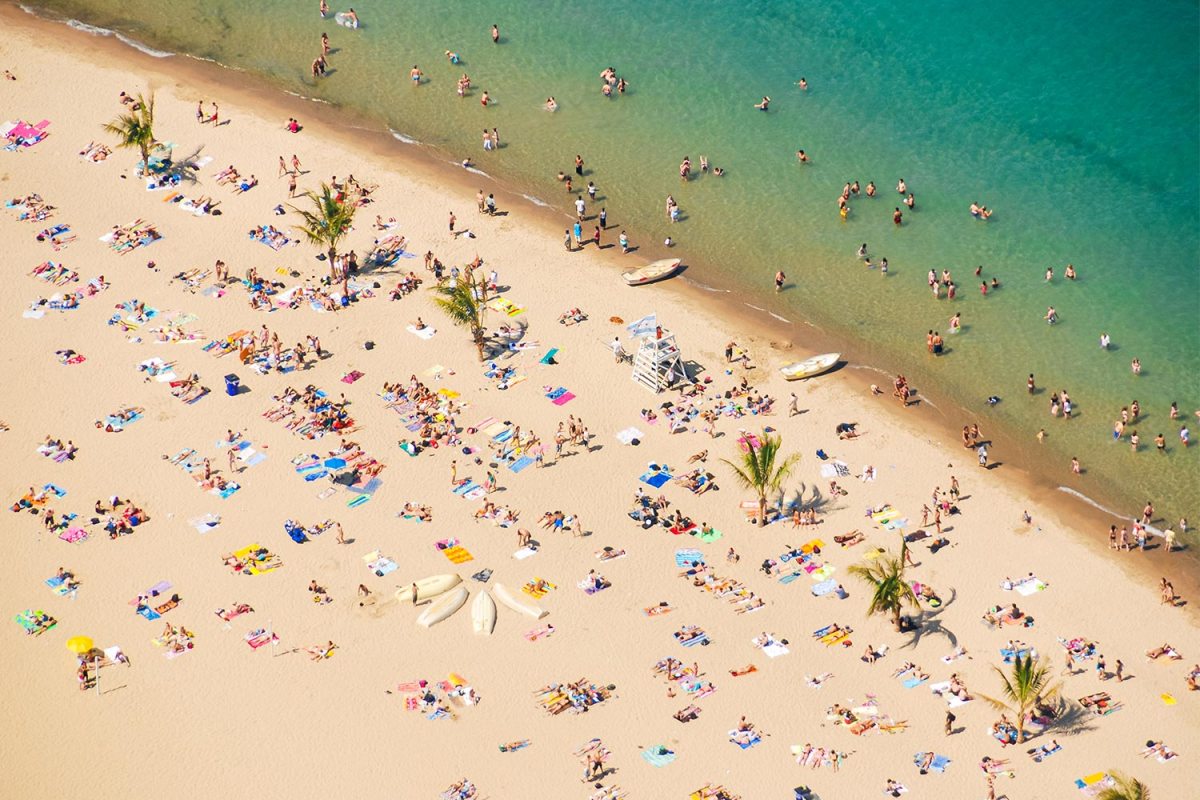 Swimmers and sunbathers at Oak Street Beach in Chicago, one of the best Chicago beaches on Lake Michigan