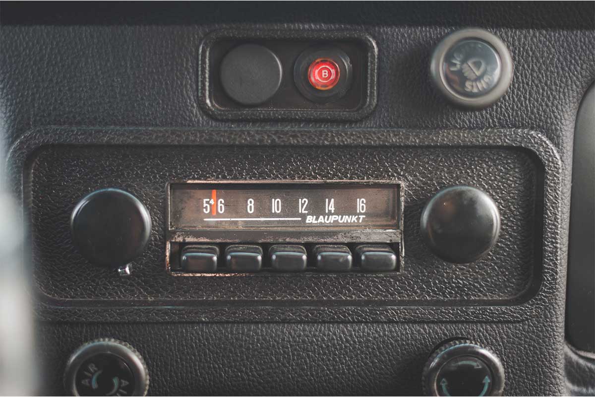 an old car radio dial. AM radio is being removed from several new car models.