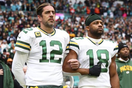Aaron Rodgers links arms with Randall Cobb.
