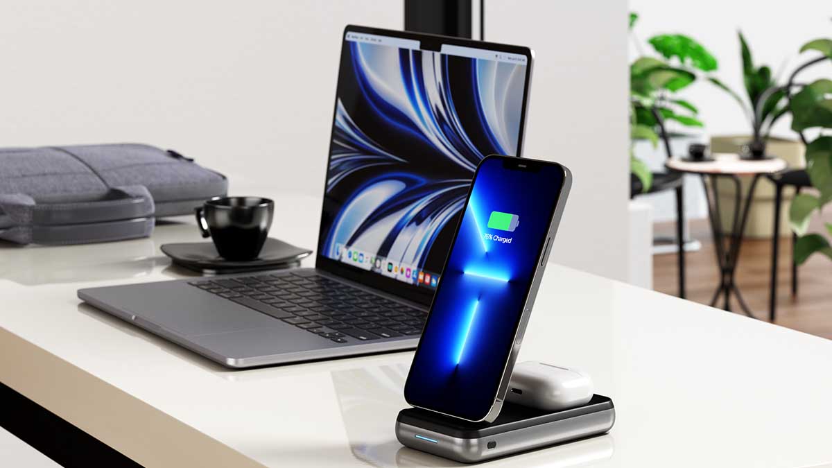 Satechi Duo Wireless Charger with a phone and earbuds charging, next to a computer