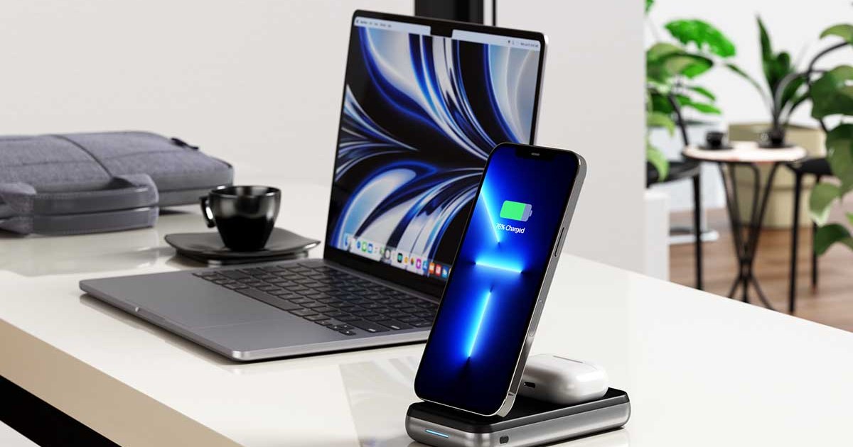 Satechi Duo Wireless Charger with a phone and earbuds charging, next to a computer