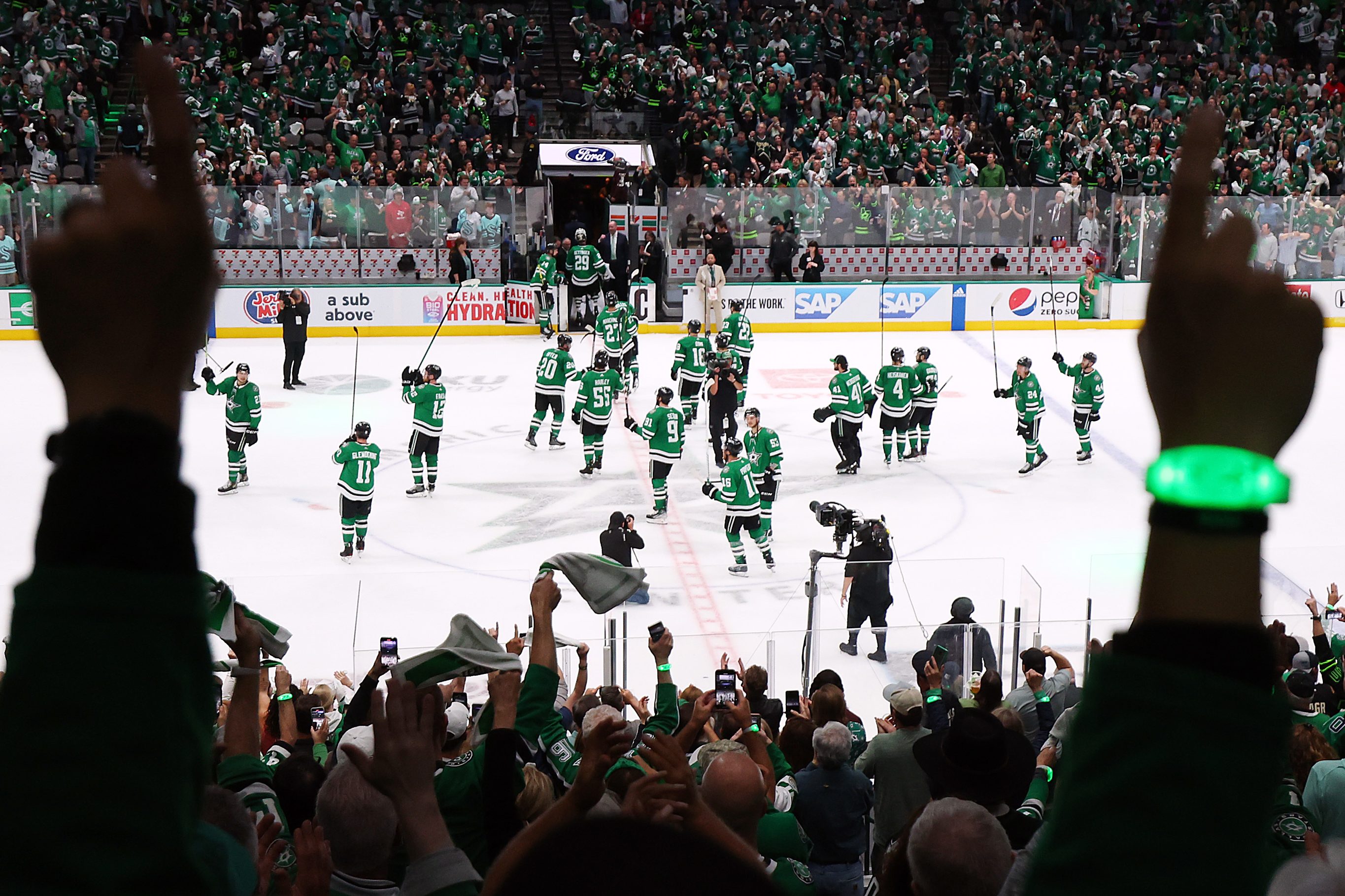 Fans celebrate the Dallas Stars' win over the Seattle Kraken.