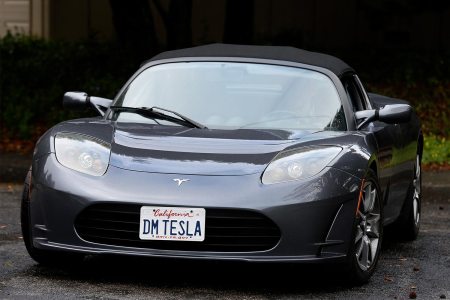 Dale Miller drives his Tesla Roadster in San Rafael, Calif. on Thursday, March 15, 2018. Miller's Roadster, number 1191 off the assembly line with the license plate DM TESLA, is the first of three Teslas he and his wife own.