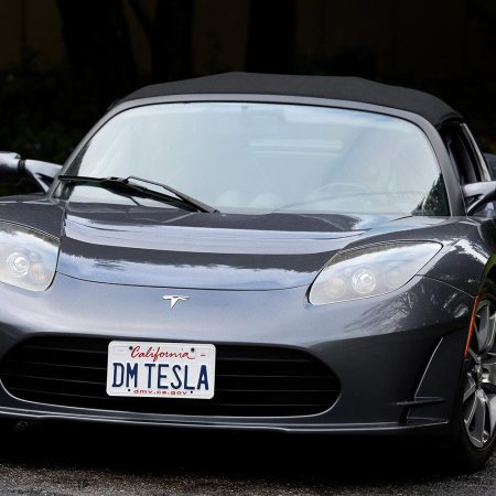 Dale Miller drives his Tesla Roadster in San Rafael, Calif. on Thursday, March 15, 2018. Miller's Roadster, number 1191 off the assembly line with the license plate DM TESLA, is the first of three Teslas he and his wife own.