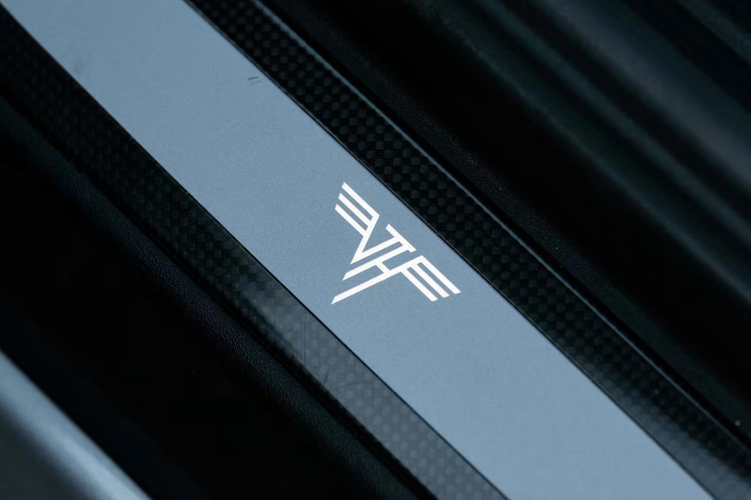 The Van Halen "VH" logo on carbon fiber door sills in Eddie Van Halen's 2016 Porsche 911 GT3 RS