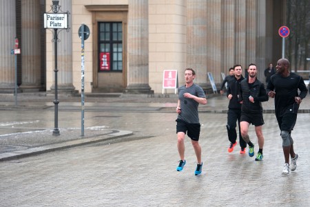 Mark Zuckerberg running with bodyguards in Berlin.