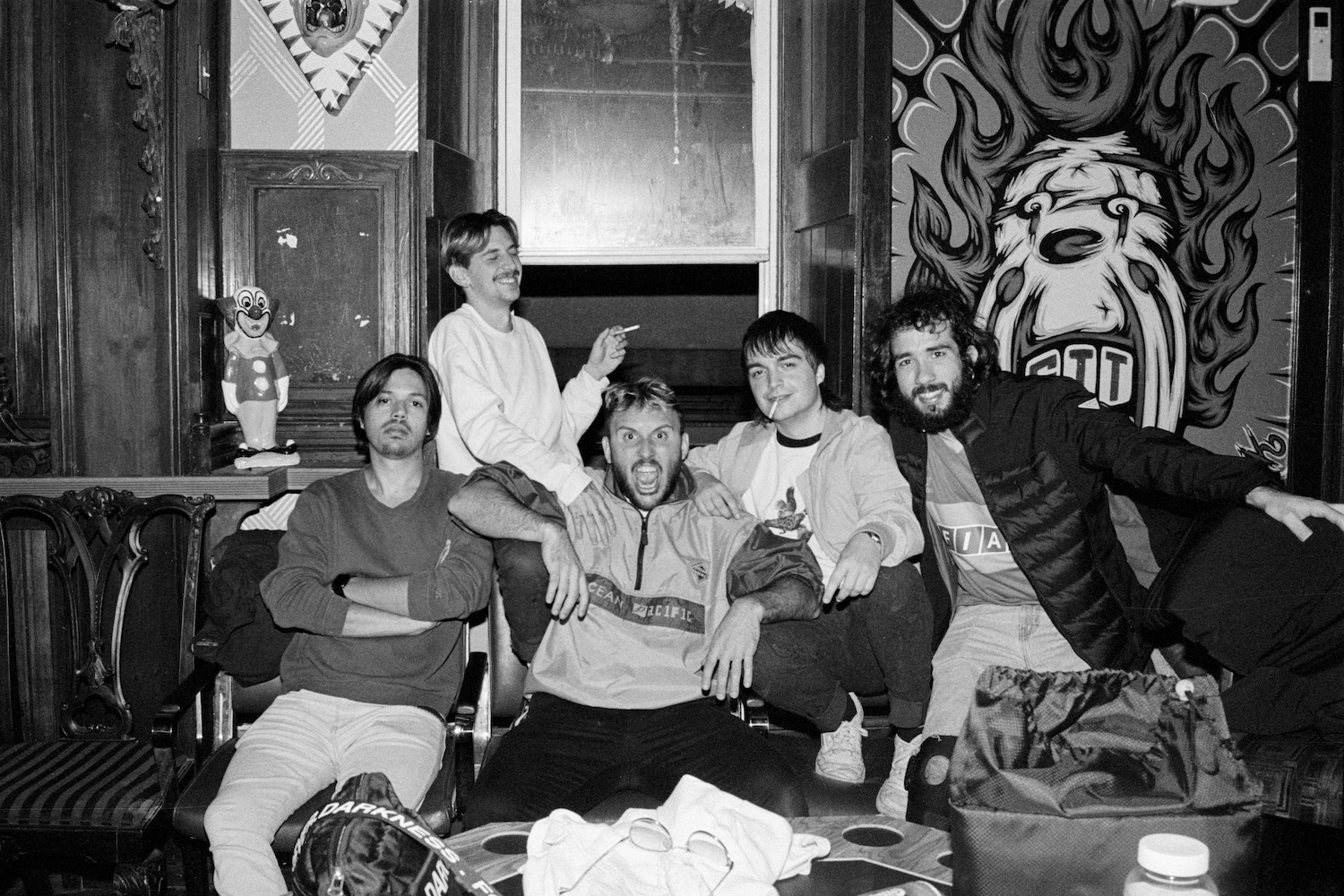 band members sitting on the couch